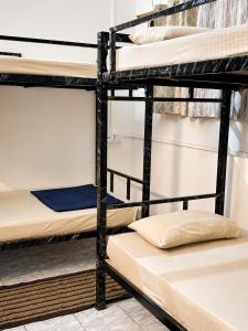 a group of bunk beds in a dorm room at Zion Backpackers Hostel in Guwahati