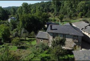 an aerial view of a house in a field at La Ribera del Río in Trefacio