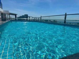 a swimming pool on the roof of a building at Thăng long II Hotel flc sầm sơn Thanh Hóa in Sầm Sơn
