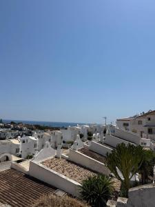 a view of the roofs of white buildings at Marbella Sunseat apartment in Marbella