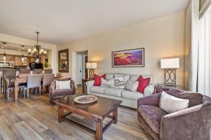 a living room with a couch and a table at Walk to Beaver Creek Village - 2BR Condo with Chairlift Views, Pool & Hot Tub in Beaver Creek