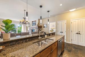a kitchen with a sink and a counter at Walk to Beaver Creek Village - 2BR Condo with Chairlift Views, Pool & Hot Tub in Beaver Creek