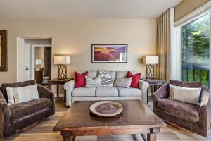 a living room with a couch and two chairs at Walk to Beaver Creek Village - 2BR Condo with Chairlift Views, Pool & Hot Tub in Beaver Creek