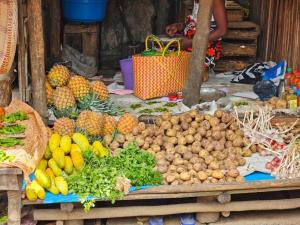 a display of fruits and vegetables on a table at ITAMPOLO Suites & Lodges in Nosy Be