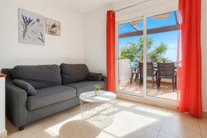 a living room with a couch and a table at Ibiza Bramer 7 - ImmoBarneda in Roses