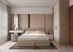 a bedroom with a large bed and a desk at Westlake House By Jen in Hanoi