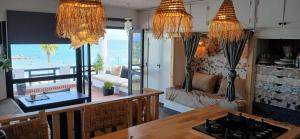 a living room with a view of the ocean at Espectacular dúplex a pie de mar in Cabo Negro