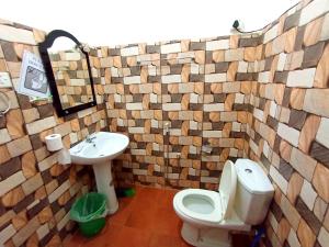 a bathroom with a toilet and a sink at Sasaa Guest House in Mirissa +73 photos