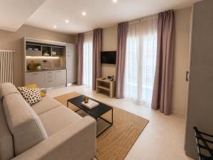 a living room with a couch and a table at Residence Danio in Alassio