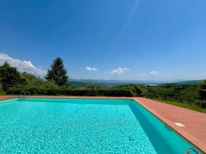 a swimming pool with a view of the mountains at Mugello View in Bovecchio