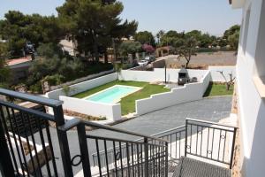 a view from the balcony of a house with a swimming pool at La Morada de Sasa Casa tierra in Torrent