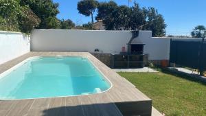 a swimming pool on top of a backyard at La Morada de Sasa Casa tierra in Torrent +1 photo