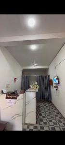 a room with a counter with flowers on it at Hotel Vanilla inn sarkanda in Bilāspur