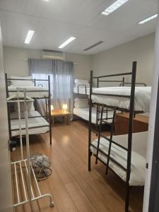 a room with four bunk beds in it at Residencial Sky Lounge in Lisbon