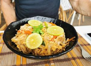 a bowl of food with lime slices on top at Sunshine Hotel - Puerto Plata in San Felipe de Puerto Plata