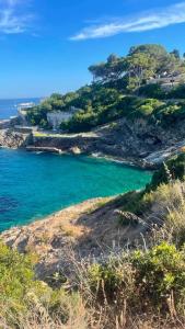a view of the ocean from a hill at Grazioso monolocale Isola d'Elba in Capo D'Arco