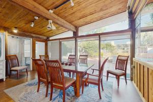 a dining room with a table and chairs at Poolside Oasis! Phoenix Group Sanctuary w/ Patio in Phoenix
