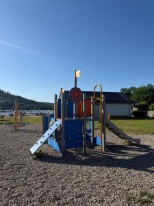 a playground with a slide in a park at Pokoje Gościnne Nad Zalewem w Starej Morawie in Stronie Śląskie +39 photos