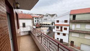 a balcony with a view of a city at Grandma Luísa's Corner in Verdelhos