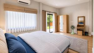 a bedroom with a large bed and a large window at Sherlock Home Pool Villa Krabi in Ban Chong Phli +26 photos