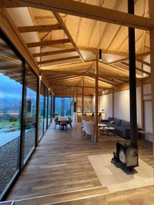 a living room with a couch and a fireplace at Amper Villa Dilijan in Dilijan