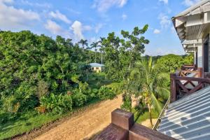 a view from the balcony of a house at Toucan Suite @ Mahogany Hall in San Ignacio