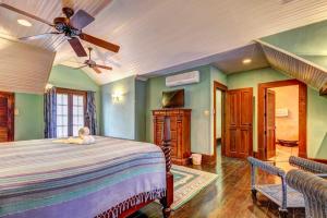 a bedroom with a bed and a ceiling fan at Toucan Suite @ Mahogany Hall in San Ignacio +29 photos