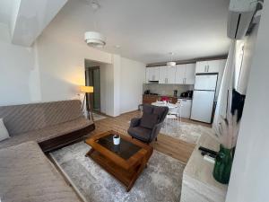 a living room with a couch and a table at Urla Garden House in Urla