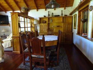 a dining room with a table and chairs at Casa Malen Llao Llao in San Carlos de Bariloche