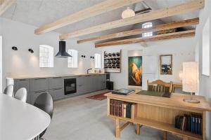 a kitchen with a table and a dining room at FA028-Karise-Tagerupvej-29 in Karise