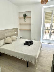 a bedroom with a large bed in a room at San Roque 7 in Archidona
