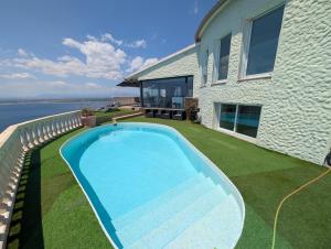 a swimming pool in the yard of a house at GMID IMMO A228 Casa Unica in Roses