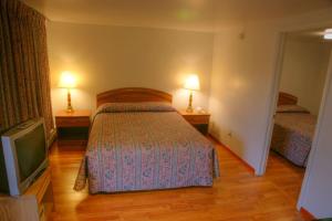 Postel nebo postele na pokoji v ubytování Mel Haven Motel