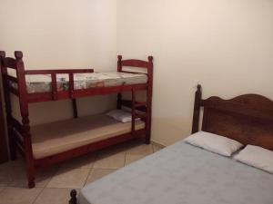 a room with two bunk beds and a bed at Chácara Mative Socorro SP in Socorro +55 photos