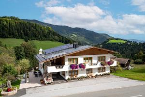 an aerial view of a house in the mountains at Haus Enzian in Thiersee