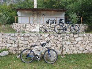 two bikes parked in front of a stone wall at Home of Laurel in Kotor