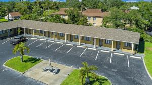 an overhead view of a building with a parking lot at Lumina Motel in Daytona Beach