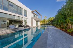 an exterior view of a house with a swimming pool at Villa Horizon Marrakech in Marrakesh