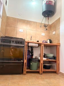 a kitchen with a counter and a stove in it at Tu lugar de descanso III in Federación