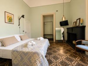 a bedroom with a bed with towels on it at Palazzo Vite in Copertino