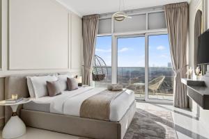 a bedroom with a large bed and a large window at FIRST CLASS Studio Inviting Luxury Escape in Dubai Marina +33 photos