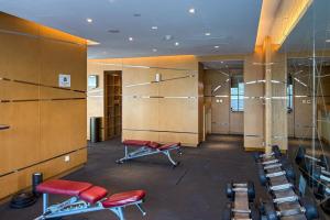 a dressing room with red chairs and shelves at FIRST CLASS Studio Inviting Luxury Escape in Dubai Marina