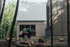 two people sitting at a table outside of a house at The Cape in Rawdon