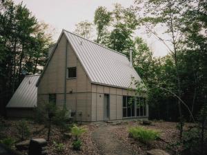 a large house with a gambrel roof at The Cape in Rawdon