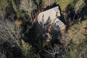 an overhead view of a house in the woods at The Cape in Rawdon +53 photos