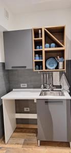 a kitchen with a sink and a counter at Luana in Caltagirone