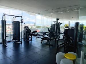a gym with treadmills and exercise equipment in a building at Park Life Nautico in Nuevo Vallarta