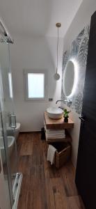 a bathroom with a sink and a mirror at Luana in Caltagirone