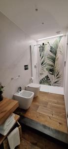 a bathroom with a white sink and a mirror at Luana in Caltagirone