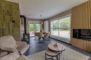 a living room with a couch and a table at Stille Wille in Ballum